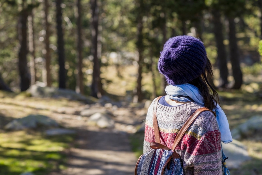 Girl with beanie in forest